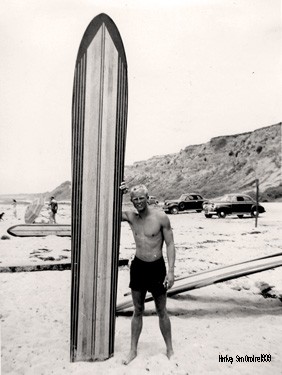 Black and White Guy on Beach with Surf Board